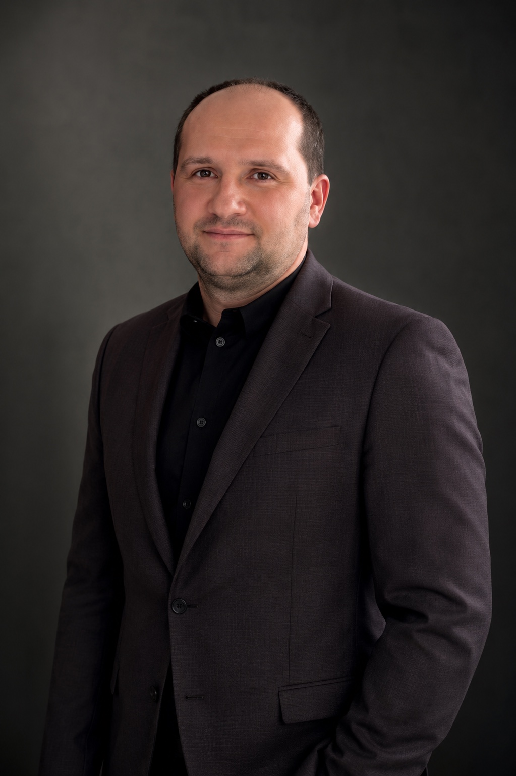 Roman Tomilovych, owner of Build Your Dream and licensed siding and deck contractor